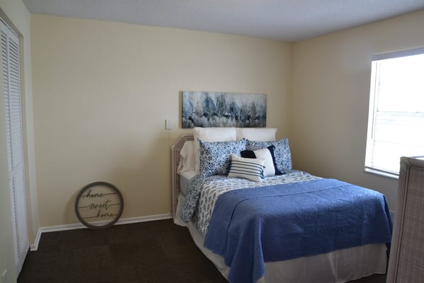 Cozy bedroom setup with home decor and bedding