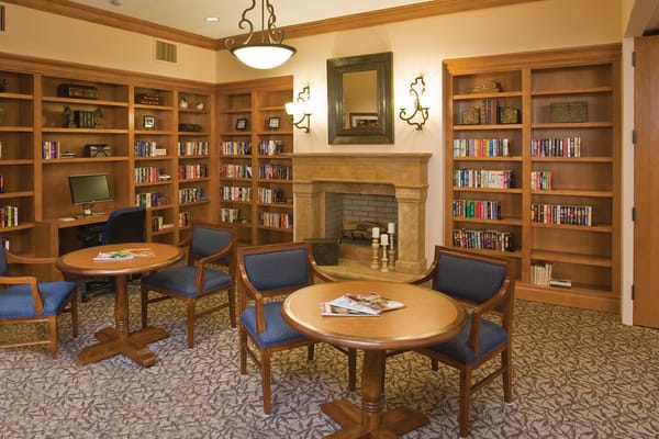 Comfortable common area with bookshelves and seating