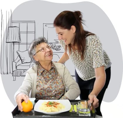 A caregiver interacting with a senior resident during mealtime