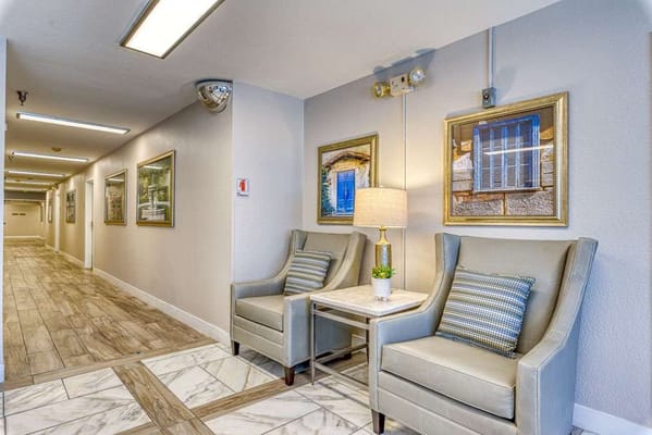 Bright hallway with seating area and artwork