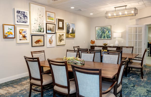 Stylish dining room with artwork and wooden tables