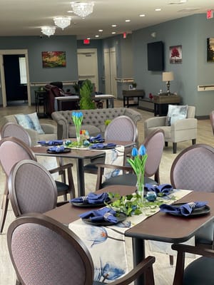 Tastefully decorated dining room with floral table settings