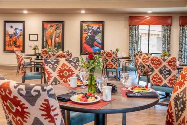 Dining area with colorful seating and food service