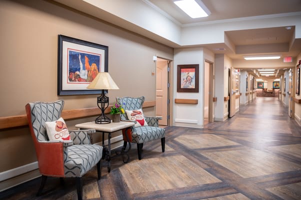 Interior hallway with seating area and artwork