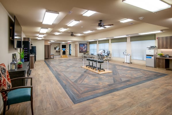 Bright activity room with tables and equipment