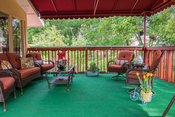Cozy outdoor seating area with foliage and flowers