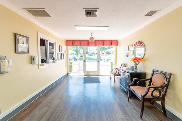 Welcoming entrance with chairs and floral decor