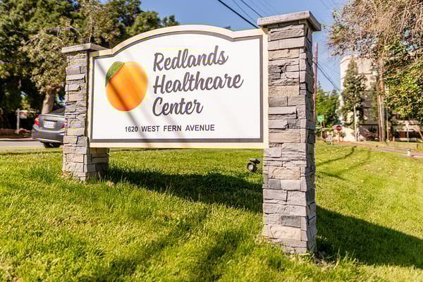 Sign for Redlands Healthcare Center at 1620 West Fern Avenue
