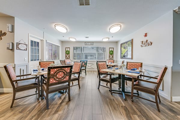Bright dining area with tables and chairs