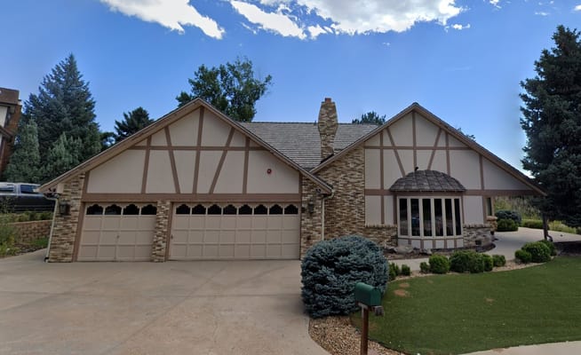 Exterior view of a residential building with landscaped yard