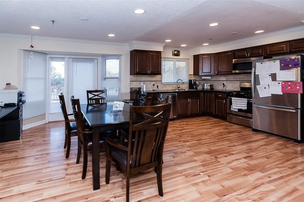 Bright kitchen area with dining table and chairs