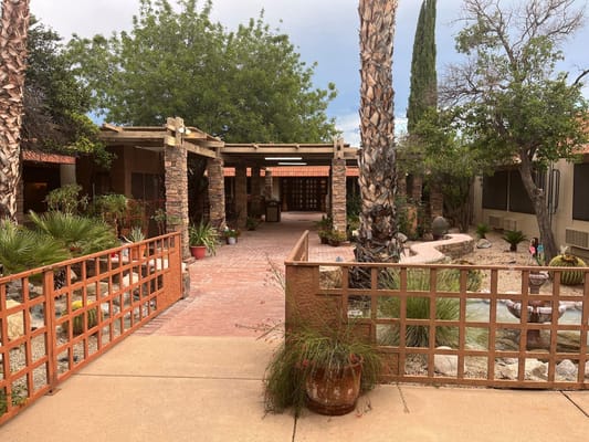 Entrance pathway with landscaping at Santa Rita Nursing and Rehabilitation Center