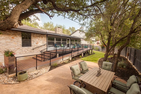 Outdoor area with patio seating and accessible ramp