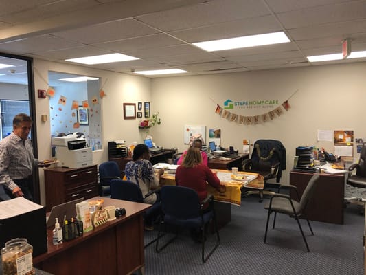 Office scene with staff enjoying a meal together