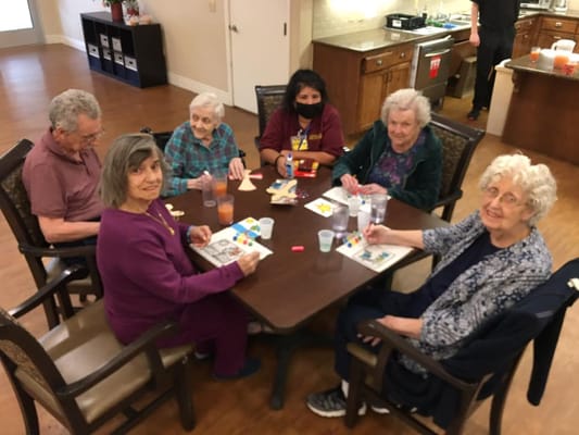 Residents engaged in an arts and crafts activity