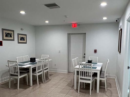 Bright dining area with tables and chairs
