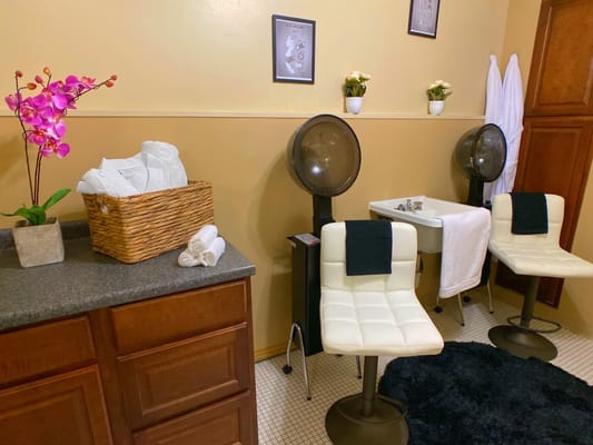 Hair salon interior with styling chairs and hair care items