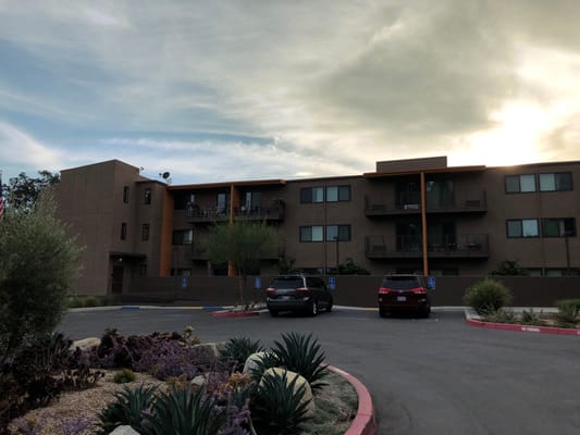 Front view of Sycamore Terrace with landscaped area and parking lot