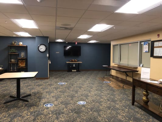 Spacious common area with decorative shelves and seating