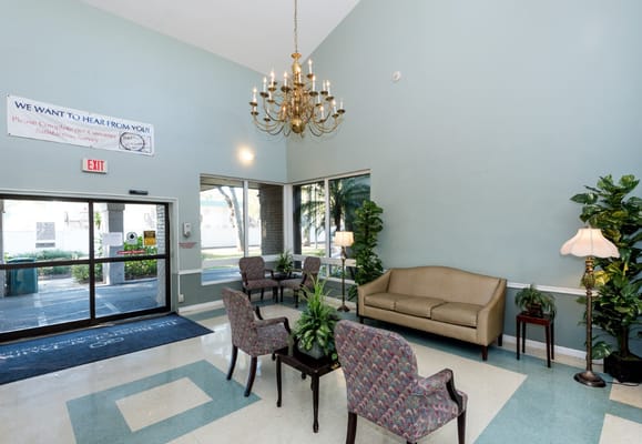 Bright lobby area with seating and plants