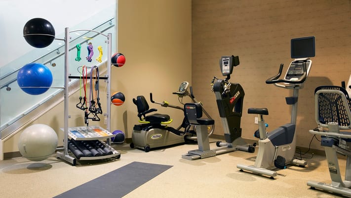 Well-equipped fitness area with exercise equipment and accessories