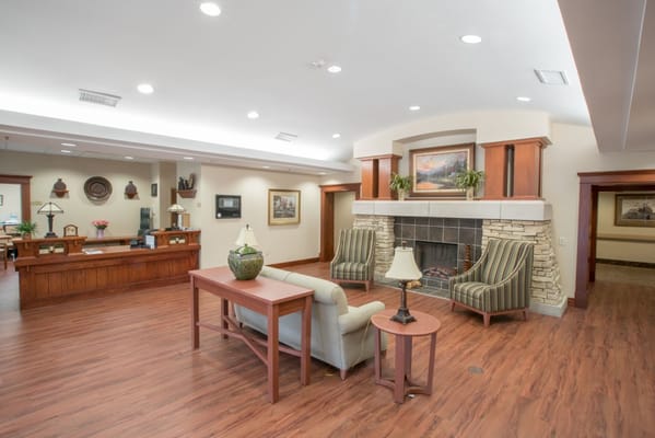 Cozy lobby with seating and fireplace