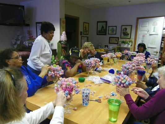 Residents participating in a craft activity at a table