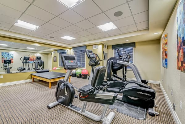 Fitness center with exercise equipment and weights