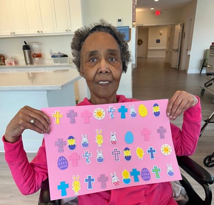 Senior resident displaying Easter-themed art