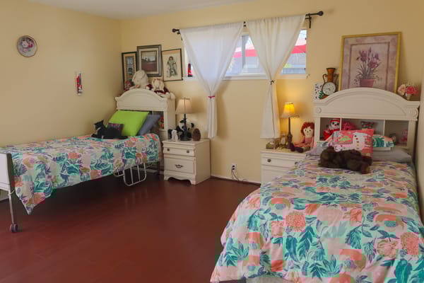 Cozy resident room with two beds and personalized decor