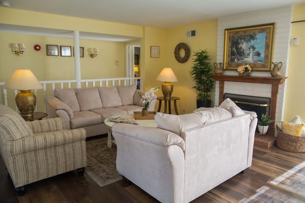 Warm and inviting common area with couches and decor