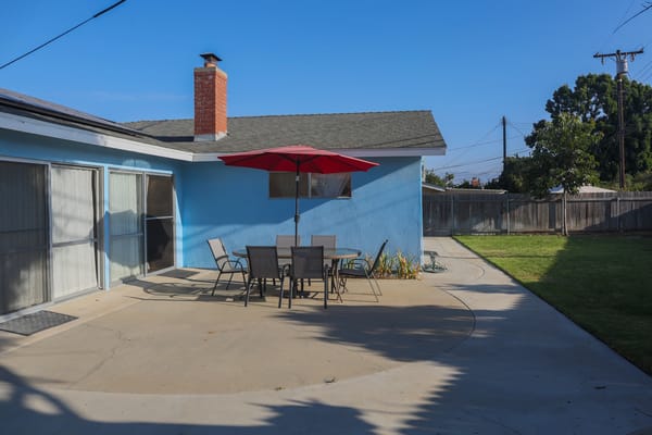 Patio area with outdoor seating and umbrella