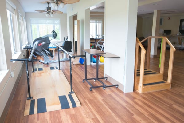 Interior view of a therapy area with fitness equipment