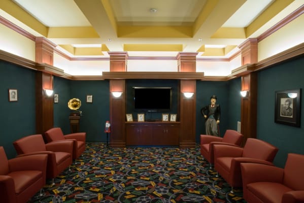 Interior view of a common area with red chairs