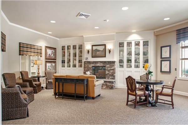 Common area in a senior living facility with seating and decor