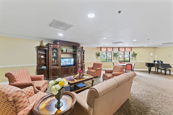 Cozy common area with seating and piano