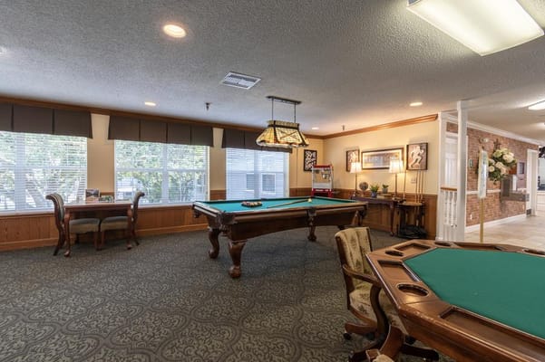 Common area with a billiards table and seating