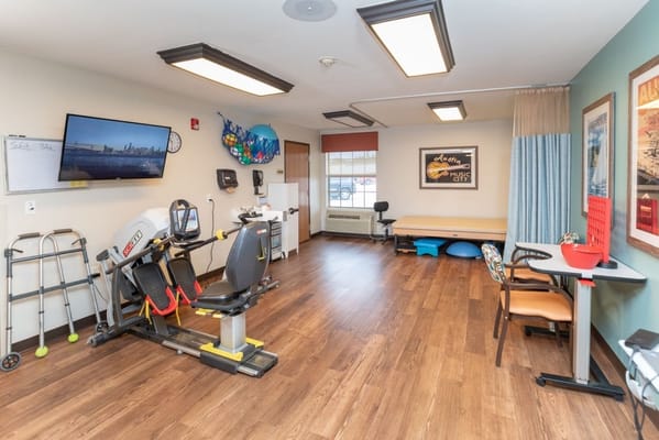 Interior view of a therapy room with exercise equipment