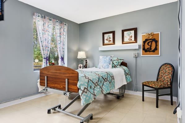 Private resident room with a bed and decorative elements