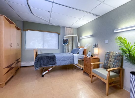 Private resident room with bed and seating area