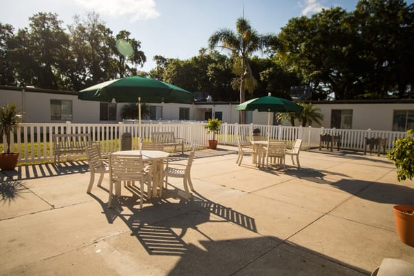 Spacious outdoor patio with tables and umbrellas