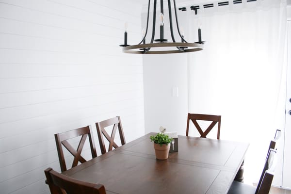 Dining area with wooden table and chairs