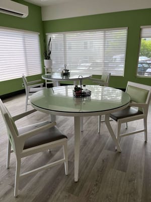 Bright and modern common area with tables and chairs