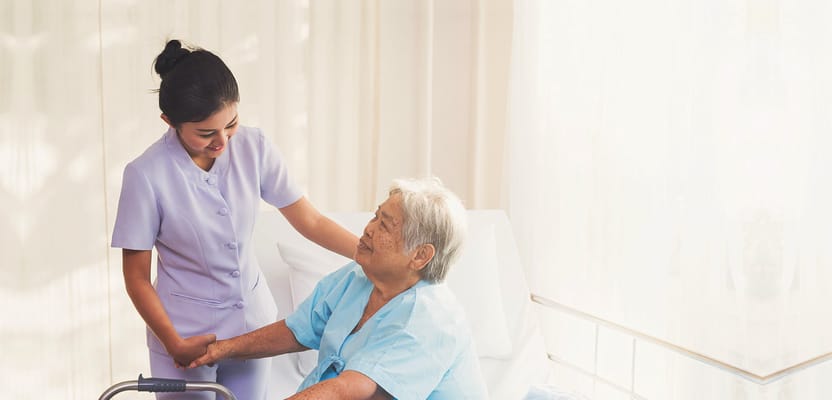 Caregiver assisting an elderly resident in a facility