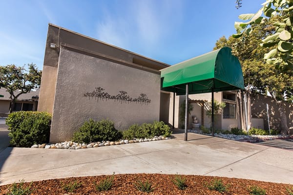 Exterior view of the facility entrance with green awning