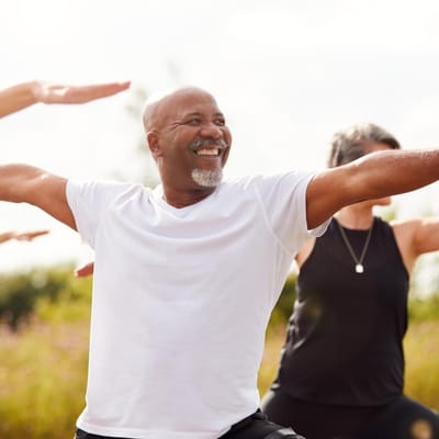 Residents participating in a yoga class outdoors