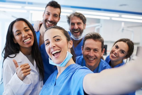 Healthcare staff smiling in a bright room