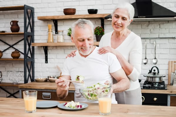 Couple enjoying a meal together in a modern kitchen