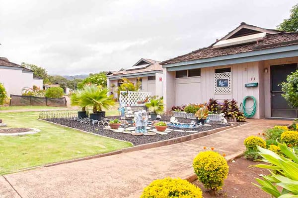 Outdoor scene with landscaped area and resident units