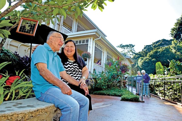 Residents enjoying time outside in the garden area
